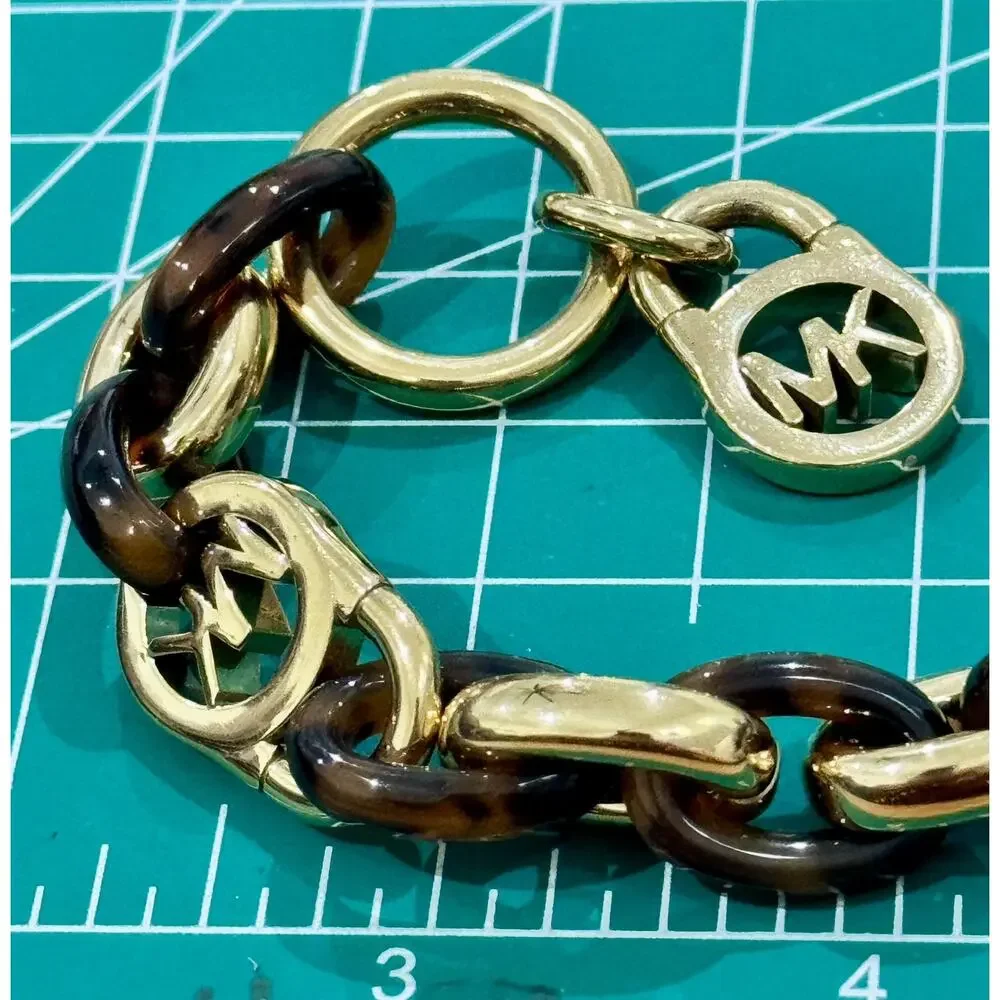 Michael Kors Tortoise Shell And Yellow Gold Tone MK Oval Link Charm Bracelet 8”